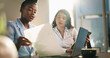 © peopleimages.com - Document, team and business women with chart for discussion, financial investment or data analysis. Paperwork, planning and workers in office with graph for stats, brainstorming or strategy with tech