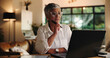 © peopleimages.com - Mature woman, laptop and remote work from home with decision, review or notes for project management. Person, virtual assistant and computer with insight, feedback and freelance career at apartment