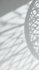 Wall Mural - abstract still life featuring intricate geometric shadow pattern cast on a blank wall and surface, m