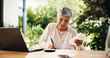 © PP/peopleimages.com - Laptop, writing and bills with old woman at home for retirement fund savings, pensioner asset and budget. Tax return, planning and loan approval with senior person in apartment for online finance