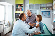 © Davor - Child girl getting a checkup at the doctor with grandfather watching