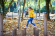 © Ekaterina Pokrovsky - Cheerful little girl having fun on playground in autumn park in Paris, France.