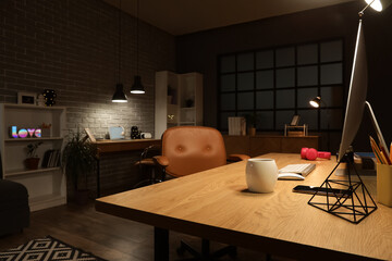 Wall Mural - interior of dark programmer's office with desks and glowing lamps at night