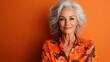 © Larisa AI - This captivating portrait showcases a smiling mature woman with stylish gray hair and floral attire, radiating confidence and warmth against a vibrant orange backdrop.