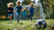 © AiiNa - Kids Playing Soccer in a Summer Field Captured from a Dynamic Side Angle with a Focus on the Ball