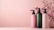 © svastix - An appealing display of trendy bottles alongside delicate pink blossoms, creating a vibrant and modern aesthetic ideal for beauty and wellness promotion.
