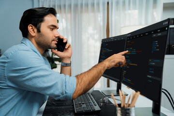 smart it developer manager calling to coworker solving problem in software coding system on pc scree