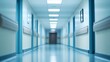 © masaidee - Blurred perspective of a long, empty hospital corridor with shiny blue floors and bright lighting, symbolizing a modern medical facility