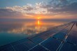 © Wajid - Sunset over solar panels, with a calm lake reflecting the glowing energy-producing technology.