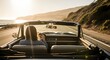 © Onisevens - Open Road Freedom: Woman Drives Convertible Along Scenic Coastline at Sunset, Evoking Adventure, Escape, and Carefree Summer Vibes
