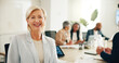© peopleimages.com - Mentor, portrait and meeting with business woman in office for strategy, brainstorming and workshop. Planning, happy and collaboration with mature employee in agency for partnership and CEO feedback