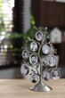 © New Africa - Family tree photo frame on wooden table indoors