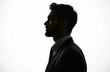 © Maryna - Silhouette profile view young unshaven businessman wearing suit. Side view of adult male with dark beard, hair, business attire isolated on white background. Portrait of person in studio with light.