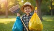 © Maryna - Young boy smiles, participates community cleanup event. Boy holds rubbish bags, broom in park on sunny day. Volunteer activity, green initiative, cleaning the environment, helping to keep city clean.