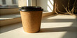 © Golam - Brown takeout coffee cup sits on the bright window sill in morning light