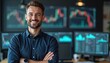 © Maryna - Happy male trader in modern office with crossed arms. Smiling man stands with background of monitors with charts, graphs. Confident pro, financial analyst at workplace, ready for success.