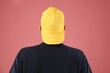 © New Africa - Young man in stylish baseball hat on pink background, back view
