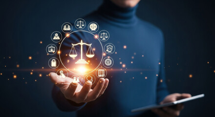person holding scales of justice with law and legal icons in a digital interface display concept
