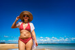 © Jacek Chabraszewski - Portrait of beautiful middle aged woman sunbather enjoying walk on sandy beach in summertime