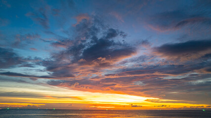 Wall Mural - aerial view beautiful sky in sunset at horizon at Kata beach Phuket Thailand. 
Scene of colorful red sky in sunset.
Gradient color. Sky texture, abstract nature background.
