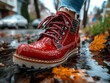 © khulyatun - Red boots, autumn street puddle, rain