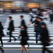 © narumiaegis - Blurred Motion of People Crossing a Busy City Street