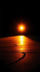 Wall Mural - Sunset Light Reflecting on a Dark Cement Floor with Tire Marks and Scratches vertical
