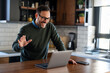 © NDABCREATIVITY - Businessman executive coach using laptop computer, having video conference call virtual meeting