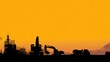 © RATTHAKORN - Construction equipment silhouetted at sunset industrial site photography urban environment landscape view machinery concept