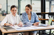 © David - Portrait of Two casual asian business women at work.doing planning analyzing the financial report, business plan investment, finance analysis concept