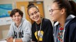 © axel - Three Indigenous youth participate in an interactive session focused on culturally relevant teachings. Their expressions reflect joy and connection as they collaborate