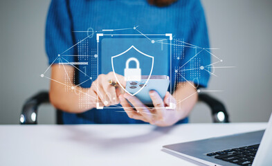 woman holding smartphone with holographic lock and data network graphics. concept of cybersecurity, 
