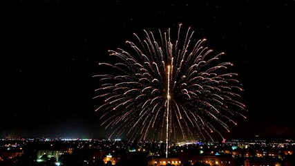 Wall Mural - fireworks in the sky above a city at night