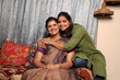 © Pix4Ads - Indian happy mother and daughter embracing each other at home