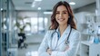 © Dream - Professional female doctor in white coat with stethoscope, standing in a bright medical office, confident smile, clean and modern background perfect for healthcare, medical services, and wellness