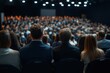 © Ahmed - Rear view of large group of people attending a press conference in convention center. Focus is on foreground