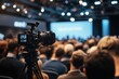 © Ahmed - Rear view of large group of people attending a press conference in convention center. Focus is on foreground