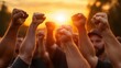 © svastix - A dynamic scene of activists raising their fists in solidarity during a sunset rally, representing unity, strength, and the power of collective voices for social change.