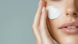 © svastix - A close-up view of a woman applying a creamy skincare product to her face, radiating beauty, and self-care while highlighting healthy skin and relaxation.