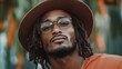 © Larisa AI - A fashionable man wearing glasses and a hat strikes a confident pose outdoors, surrounded by lush greenery that enhances his stylish appearance and unique vibe.
