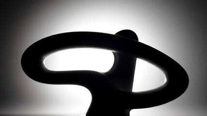 Dark Abstract Sculpture With Contrasting Backlight And Elegant Design