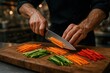 © Bijac - Master chef's hands expertly julienning fresh vegetables with professional knife on wooden cutting board
