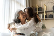 © Art_Photo - Portrait of enjoy happy love asian family senior mature mother and young daughter smiling play laughing and having fun together at home, care, elderly, insurance.happy family and Mother Day concept