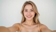 © หมู ทําอะไรก็อร่อย - a beautiful young woman in her early 20s, fair skin, taking a selfie with one arm extended toward the camera, her hand and wrist are cropped out of the frame, only her arm is visible reaching forward
