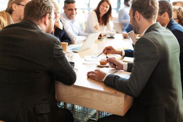 Wall Mural - group of professionals in a meeting, discussing ideas. diverse team collaborating, sharing insights.