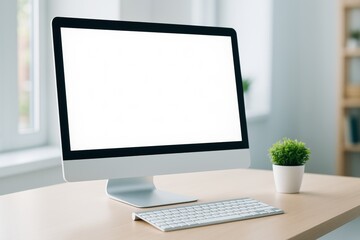 Modern desktop computer with blank screen on wooden table in bright office room, minimal workspace concept with copy space for design or promotion.