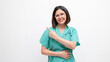 © Ari Style Shots - Female doctor medical proffesional with surgery teal scrubs smiling at camera pointing up over left shoulder on white background