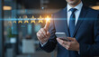 © Jobcens - Businessman writing to review and give glowing golden stars for excellent rating from evaluation survey after use product and service , Customer experience and quality feedback concept