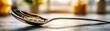 © Jiraporn - Low sugar habit with diet adjustment and detox plan concept. A close-up of a shiny spoon resting with sugar granules.