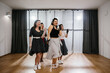 © dsheremeta - Four women dancing rock and roll and wearing fifties style polka dots clothes